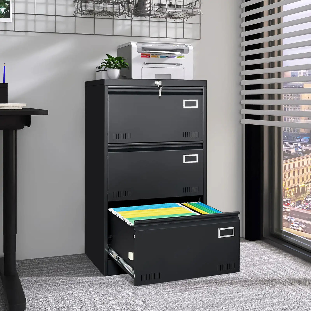 Black three drawer document chest arranged in a clean modern office setup alongside a computer desk. #black #3 drawers