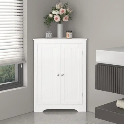 corner storage cabinet with double doors seamlessly fitted in a bathroom topped with decorative accessories