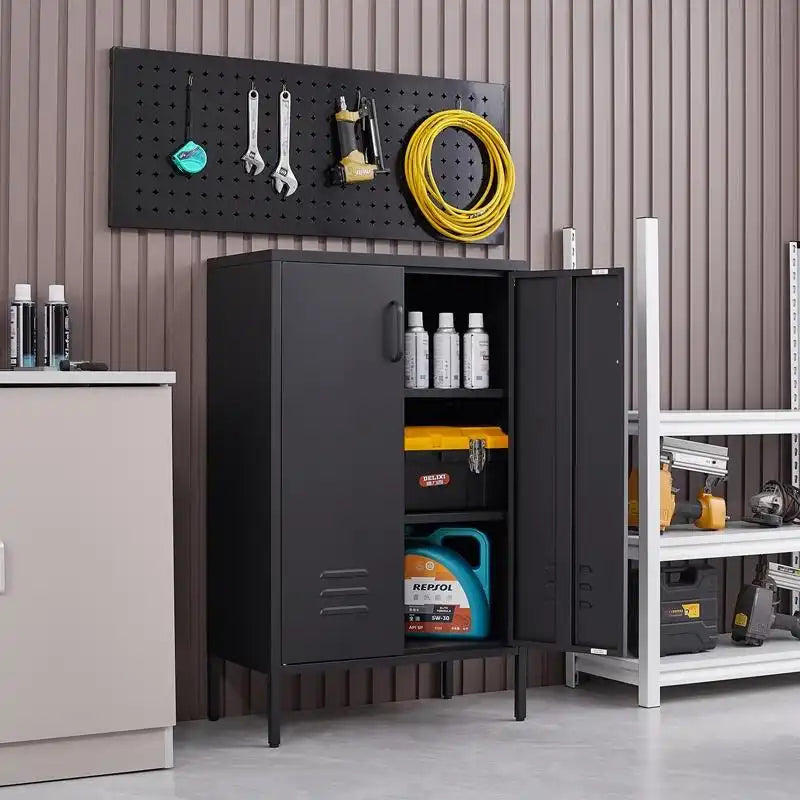 An open black metal utility cabinet in a garage workshop storing motor oil, toolbox, and automotive supplies under a pegboard setup.