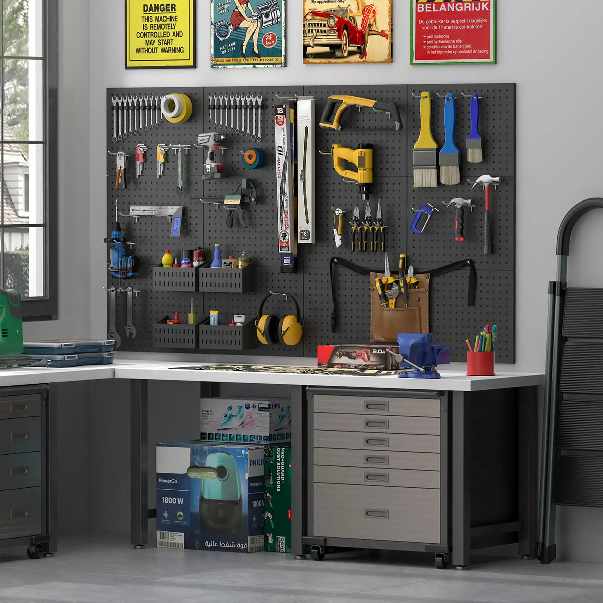 Black metal pegboard panels mounted above a workshop workbench displaying various hand tool accessories.