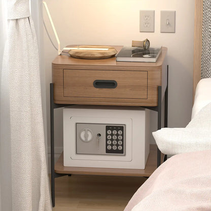 mini electronic safe tucked neatly under a wooden nightstand in a cozy bedroom setup