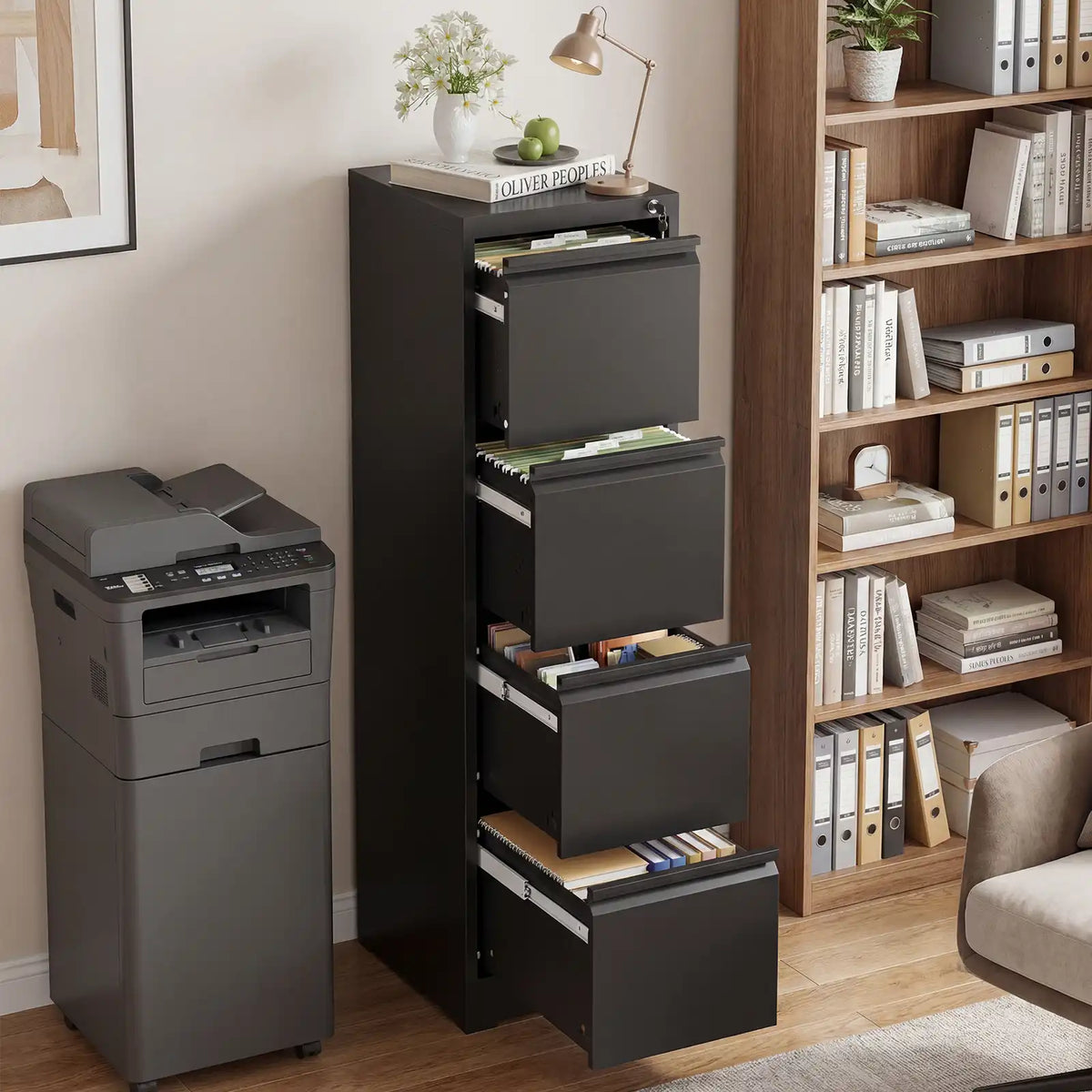 Modern black 4 drawer metal filing cabinet styled in a home office next to a printer and bookshelf. #black