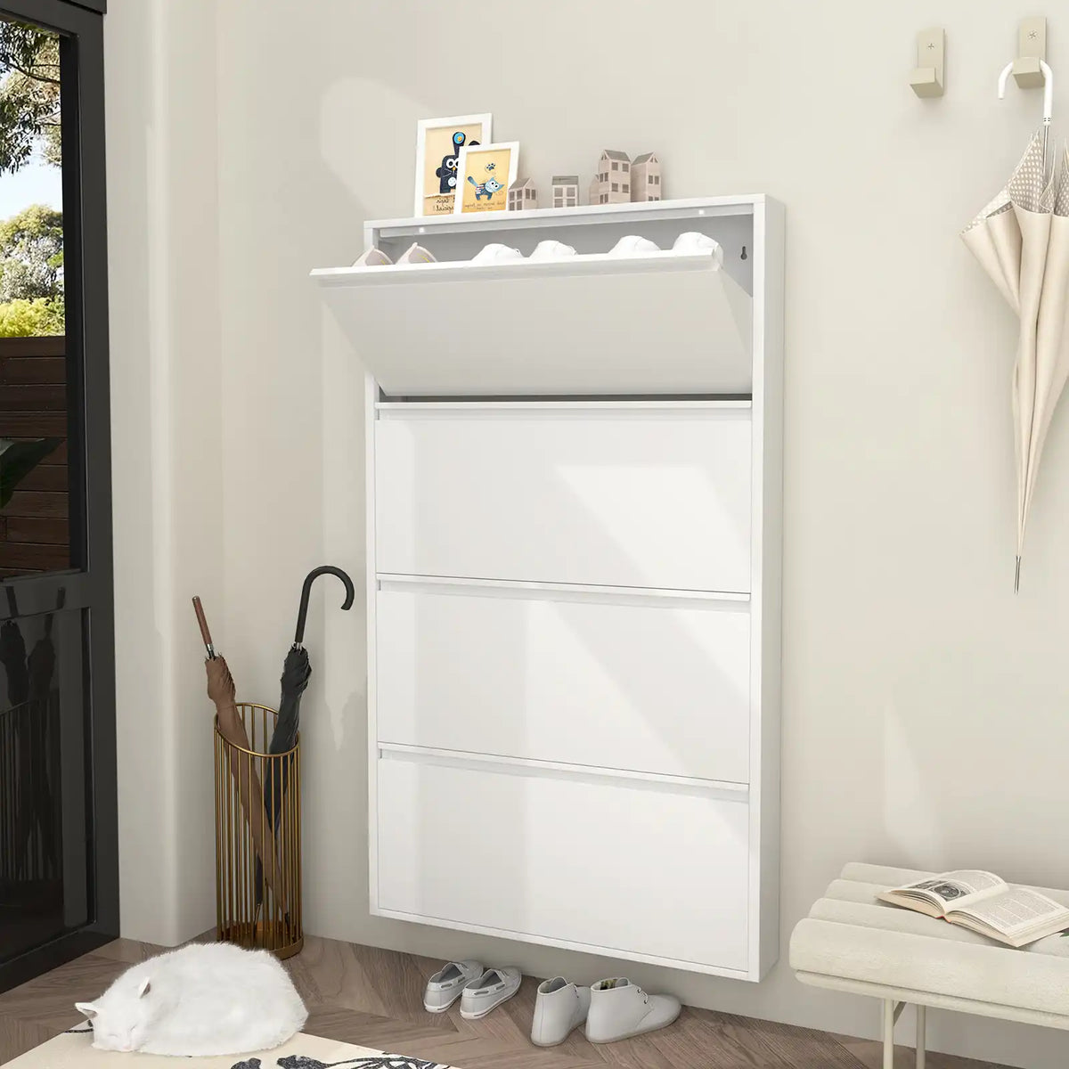 white 4 tier shoe storage cabinet mounted next to an umbrella holder in the entryway #white #4 flip drawers